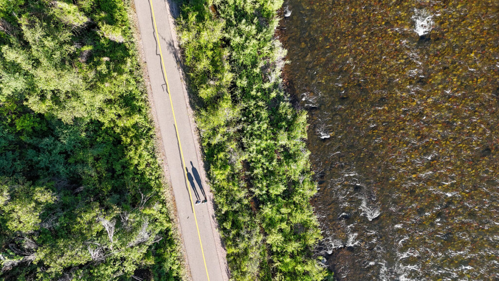 Aerial view of pedestrians walking on the Rio Grande Trail next to the Roaring Fork River