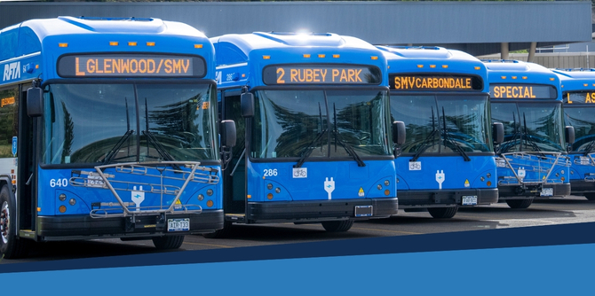 a line up of battery electric buses owned by RFTA